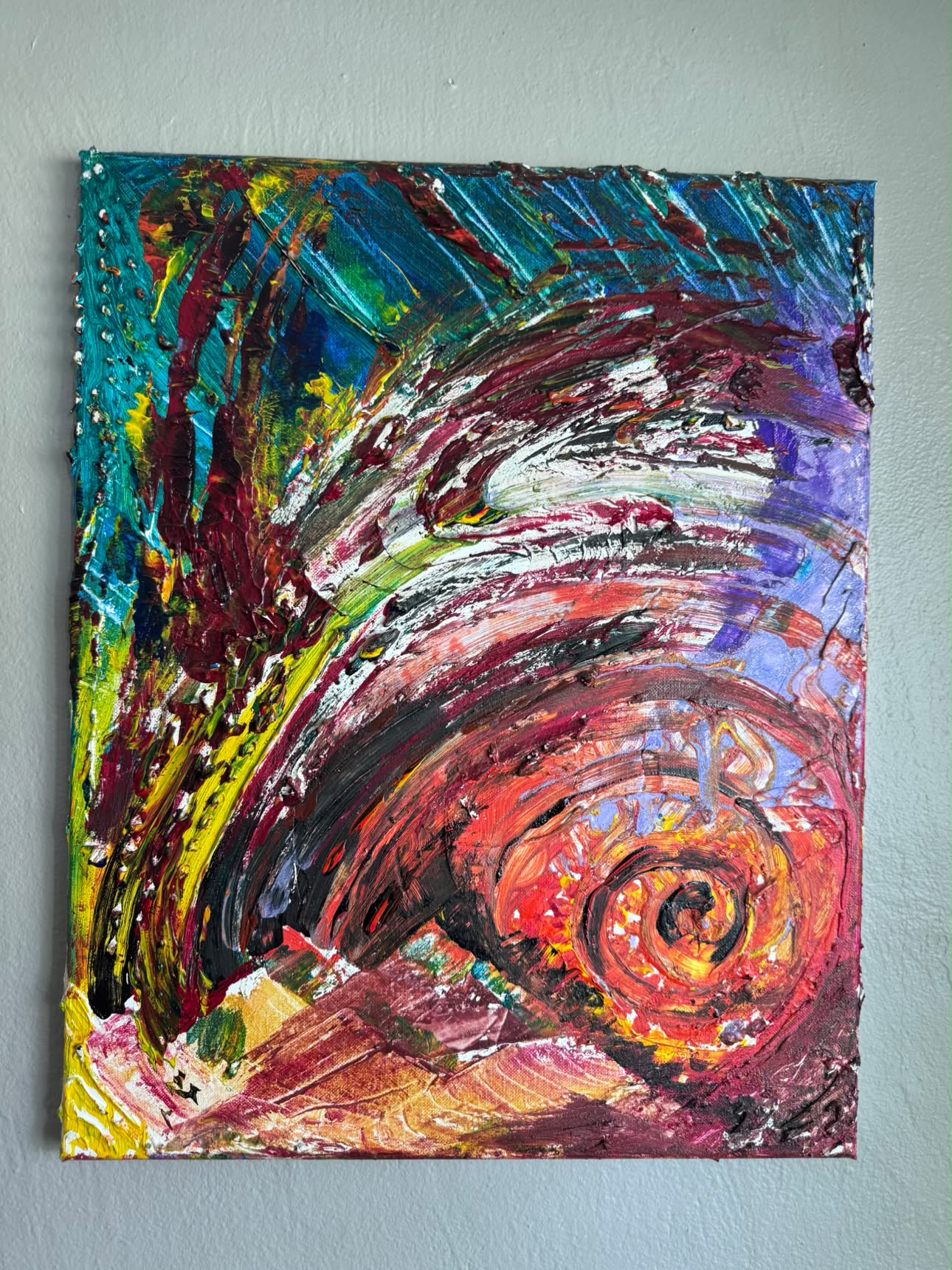 Thick impasto abstract painting with a spiral form