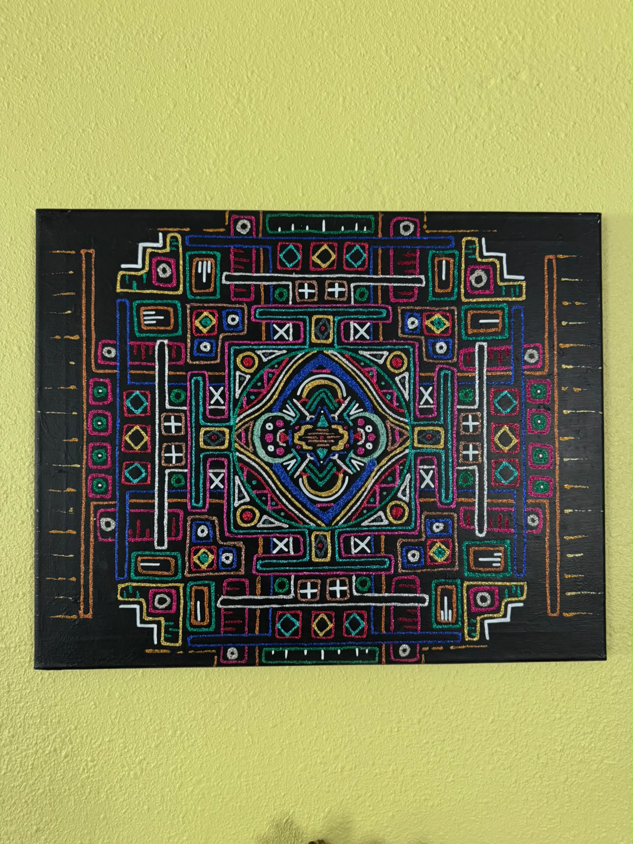Geometric patterned painting in metallic colour on black